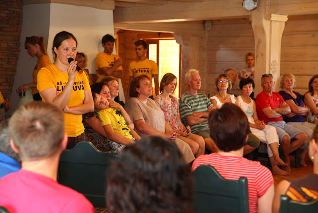 Group of people listening to Sigita speak.